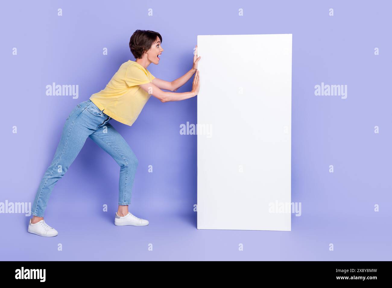 Full length portrait of cheerful pretty person arms push huge empty ...