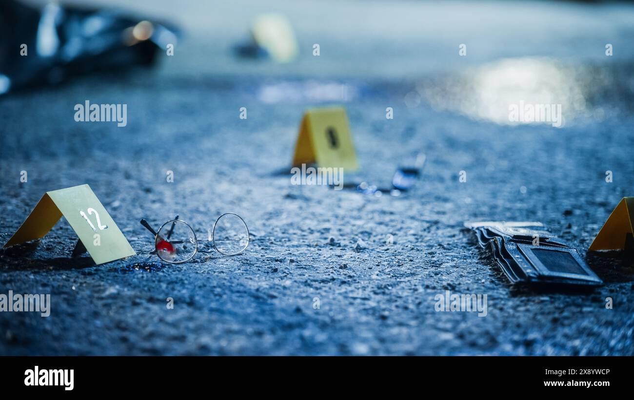 Bloodied Glasses, Bloody Knife and Empty Wallet, all Marked as Clues in a Murder Investigation. Close Up Low Angle Shot of Evidence Scattered at Crime Scene. Forensics Work by Documenting Clues Stock Photo