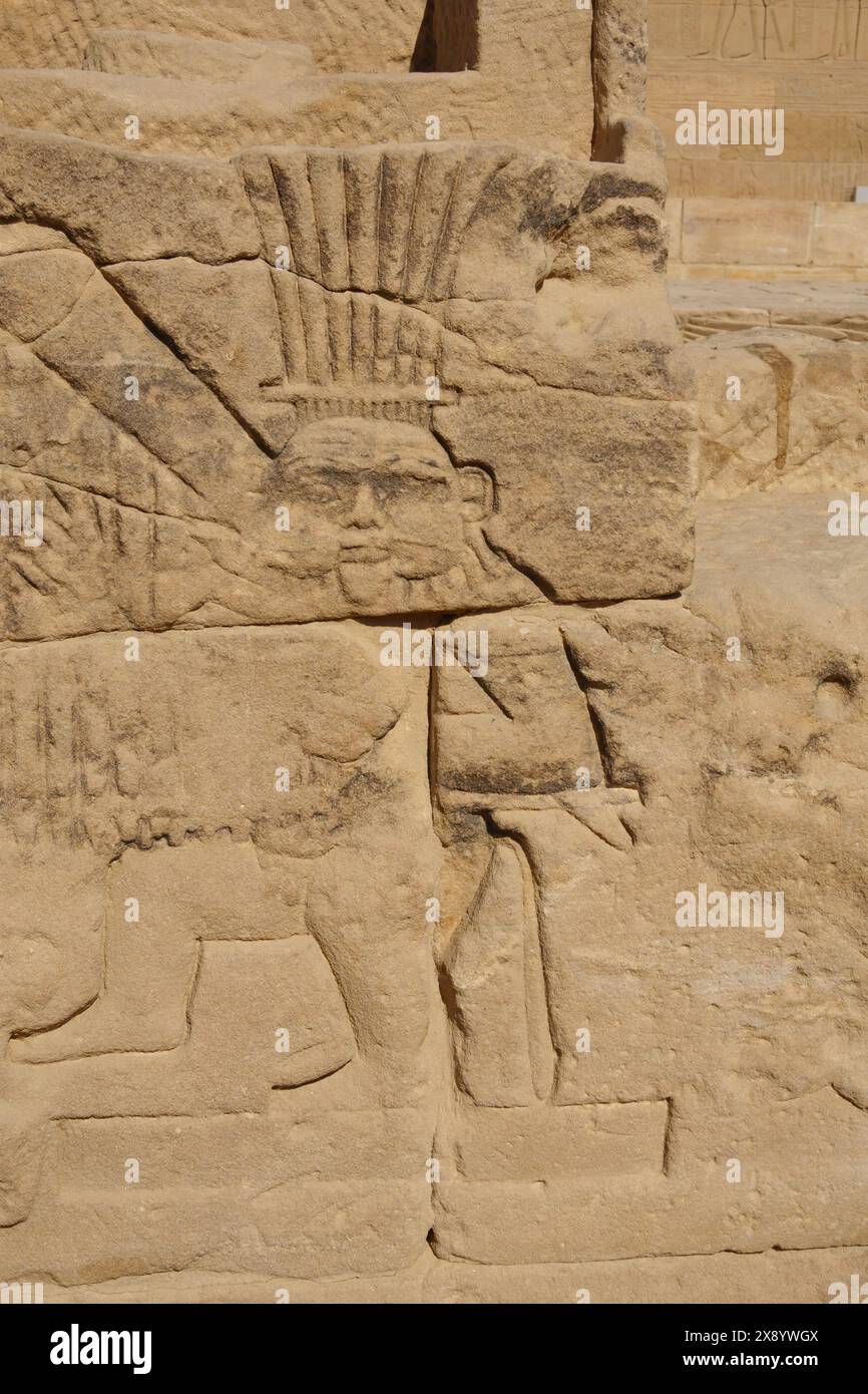 Carvings and cartouches, the God Bes, Philae Temple complex, Agilkia Island, Aswan Dam reservoir. Burial place of Osiris. Egypt Stock Photo