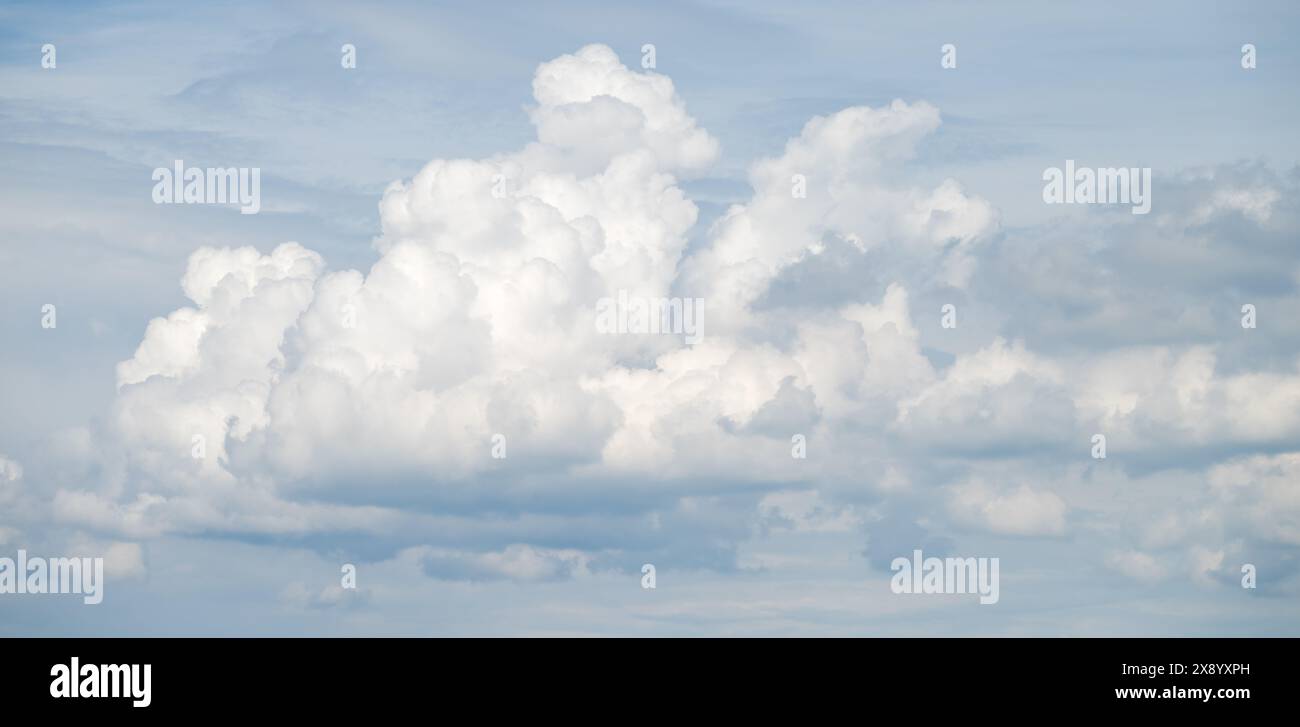 large spring cloud, cumulus cloud against white background Stock Photo