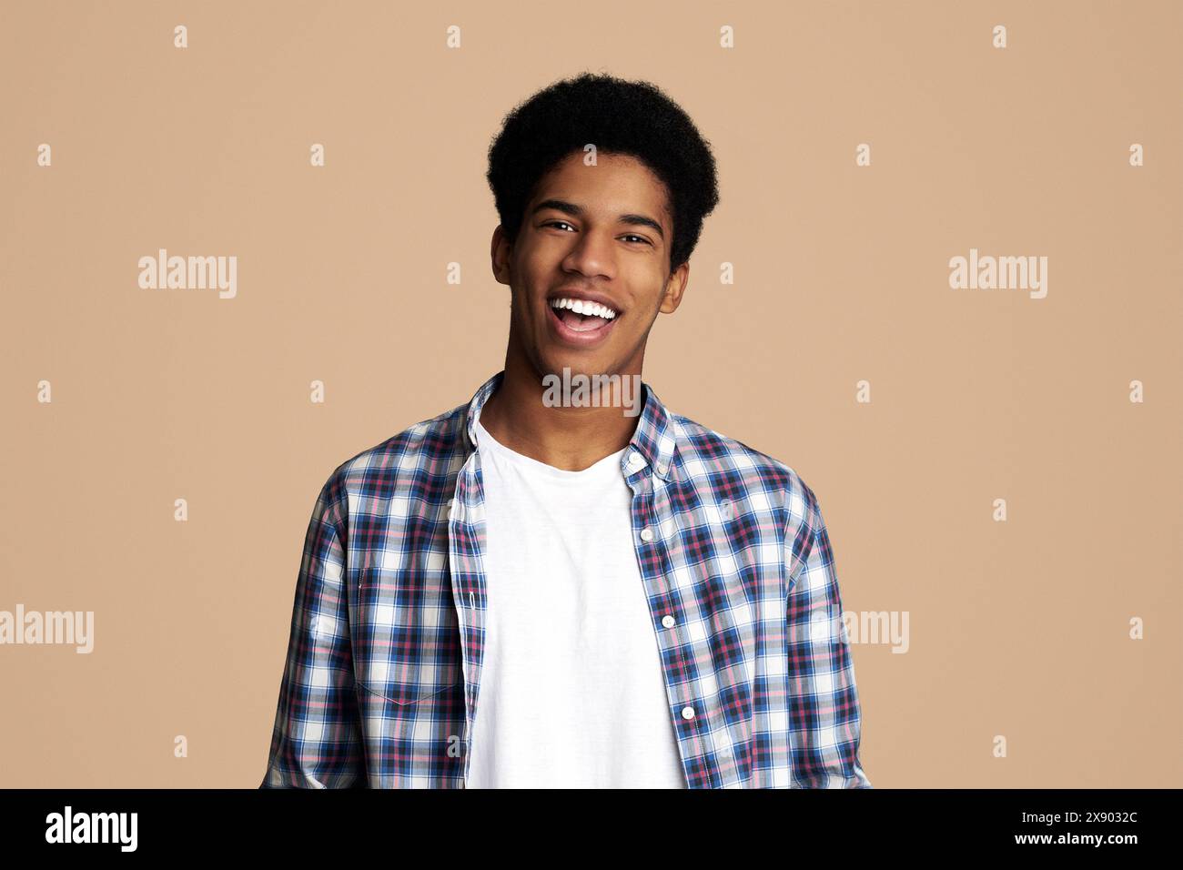 Afro Teenage Guy Posing with Hands in Pockets Stock Photo