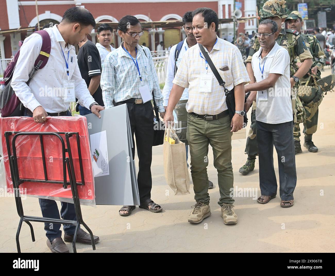 Election officials are coming out from the center with security personnel as they prepare to go door to door to collect votes. Senior citizens aged above 85 years and persons with disabilities can opt for postal ballots and cast their votes from homes announced by the Chief Election Commissioner Rajiv Kumar, this year on 19th April. Tripura, India. Stock Photo