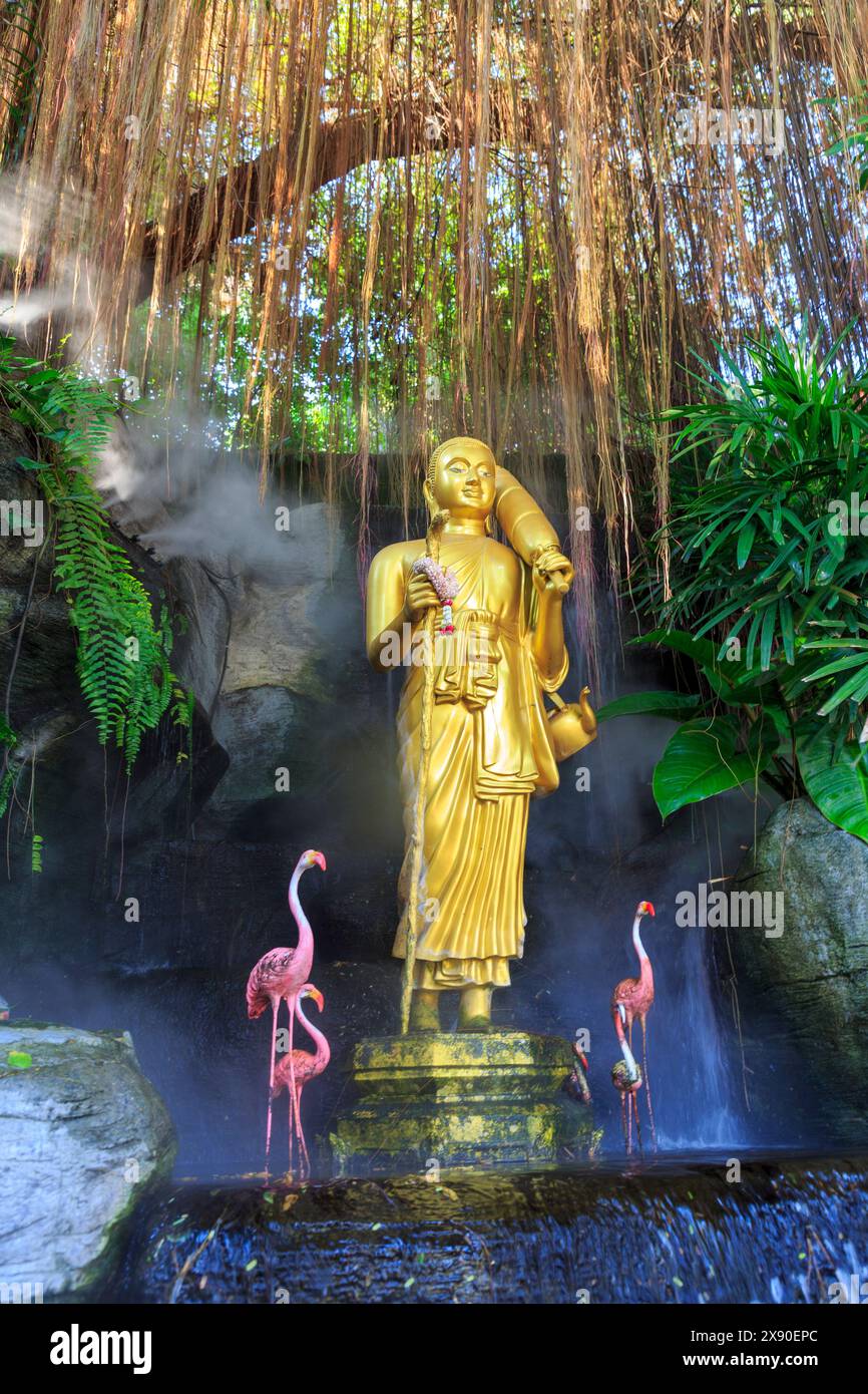 Golden figure and flamingoes, Wat Saket, Golden Mountain, Srakesa Temple, Bangkok, Thailand Stock Photo