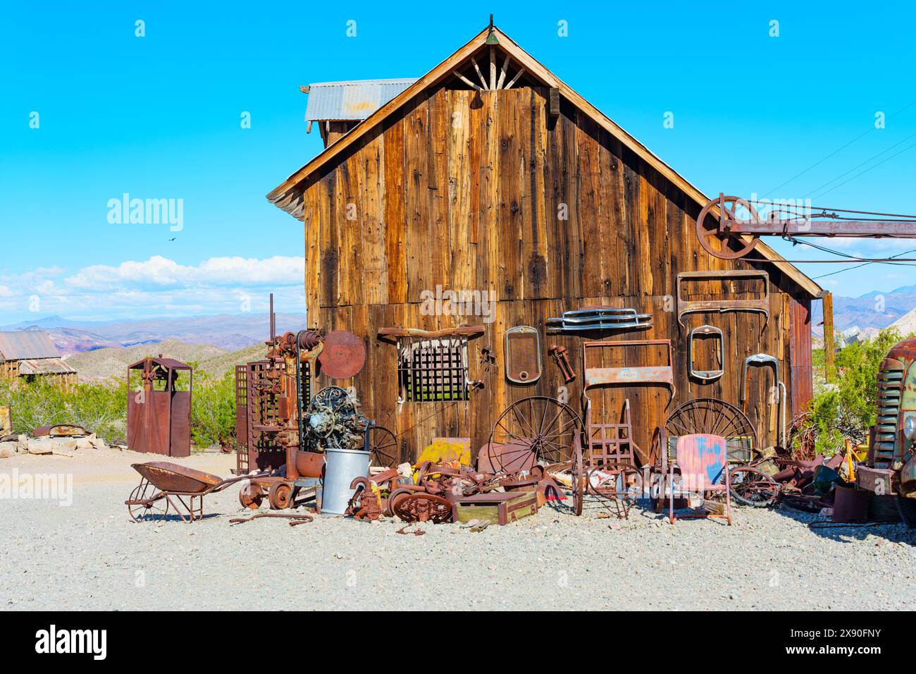 Nelson, Nevada - April 15, 2024: Weathered vintage cabin and a selection of rusted tools and equipment in Nelson Ghost Town Stock Photo
