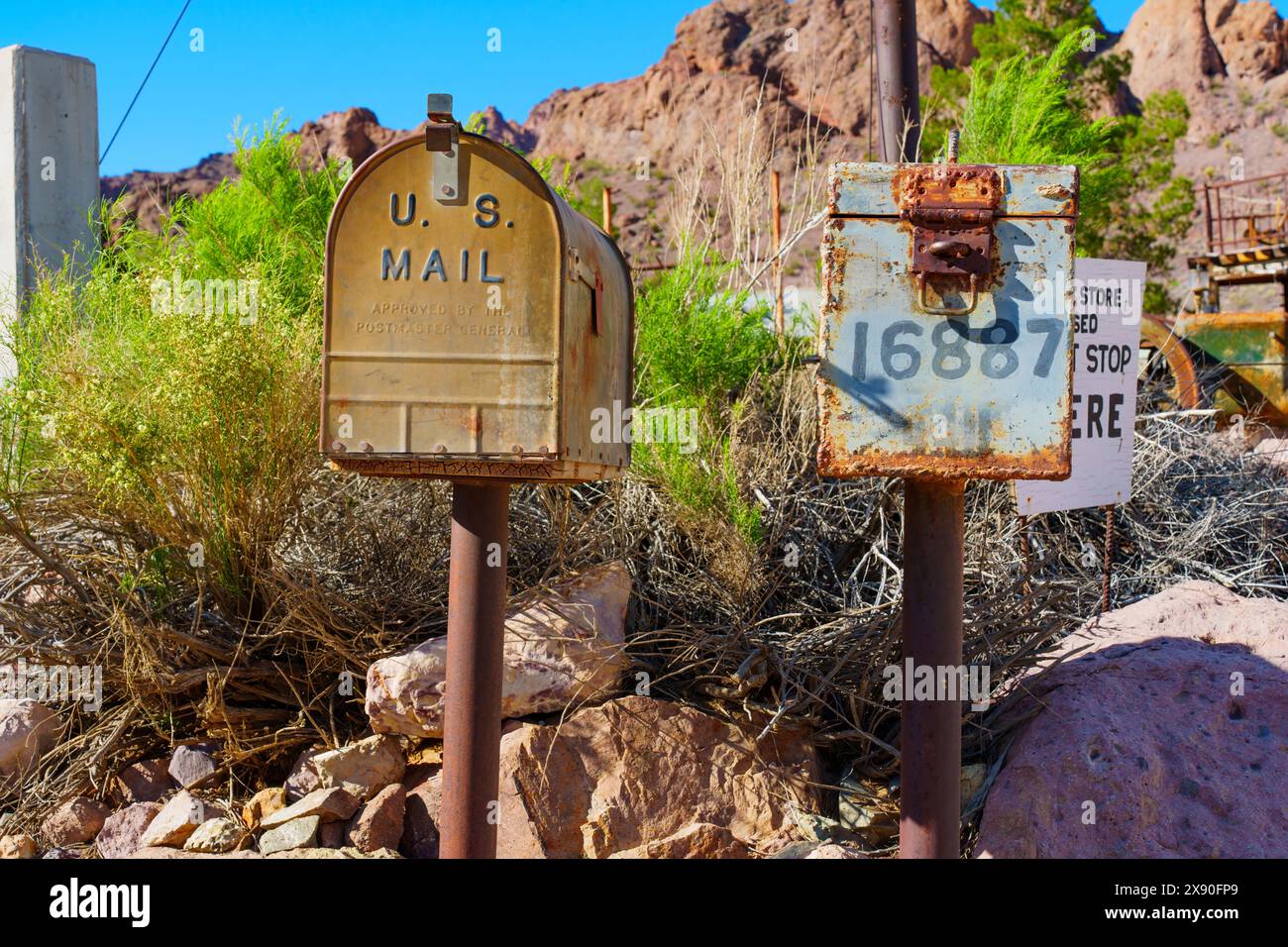 Nelson, Nevada - April 15, 2024: Two weathered vintage mailboxes stand as relics of the past in Nelson Ghost Town. Stock Photo