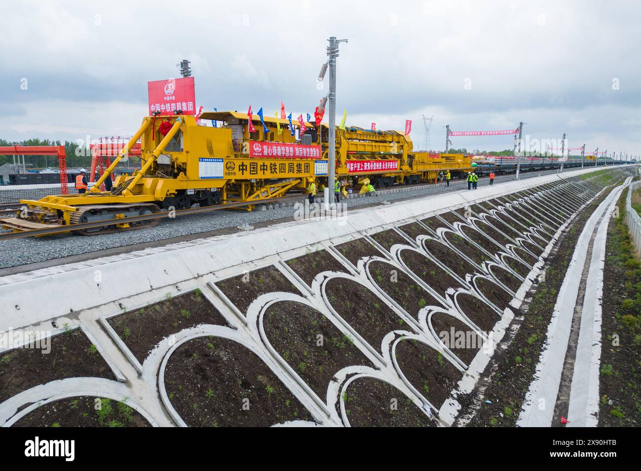 Tieli. 28th May, 2024. A drone photo shows a construction site in the Tieli to Yichun section of the Harbin-Yichun high-speed railway in northeast China's Heilongjiang Province, May 28, 2024. Track-laying for Harbin-Yichun high-speed railway commenced on Tuesday. The 318-km rail route connects Harbin, Tieli, Yichun, and a few other cities, allowing a designed train speed of 250 km per hour. It is China's northernmost high-speed railway under construction. Credit: Zhang Tao/Xinhua/Alamy Live News Stock Photo