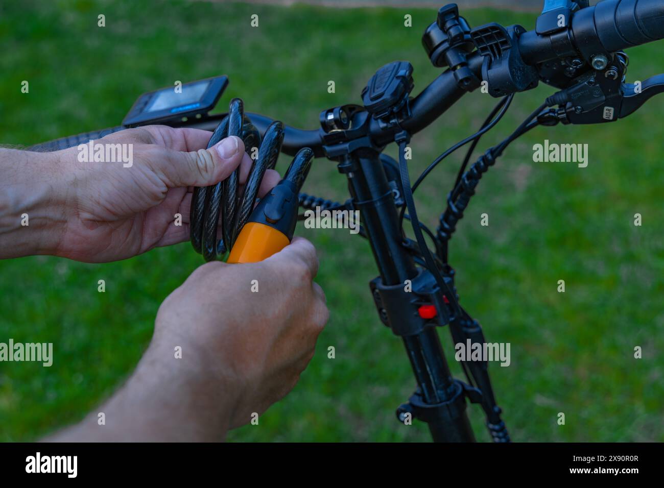 Anti-theft lock for a bicycle, audible alarm for an electric bicycle, attempted theft of a bicycle Stock Photo