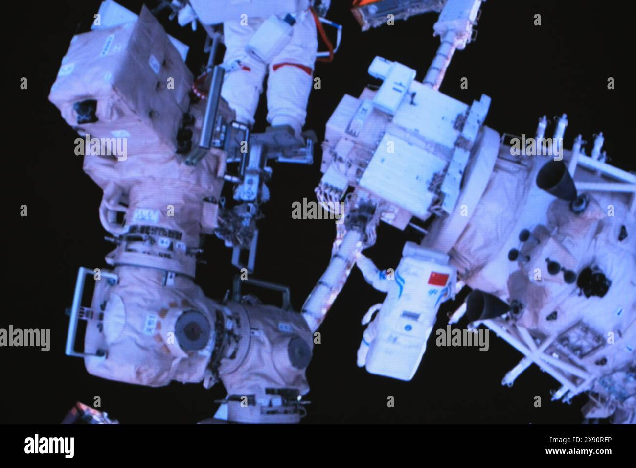 Beijing, China. 28th May, 2024. This screen image captured at Beijing Aerospace Control Center on May 28, 2024 shows Shenzhou-18 astronauts performing extravehicular activities. The Shenzhou-18 crew members on board China's orbiting space station completed their first spacewalk on Tuesday, according to the China Manned Space Agency. Credit: Li Jie/Xinhua/Alamy Live News Stock Photo