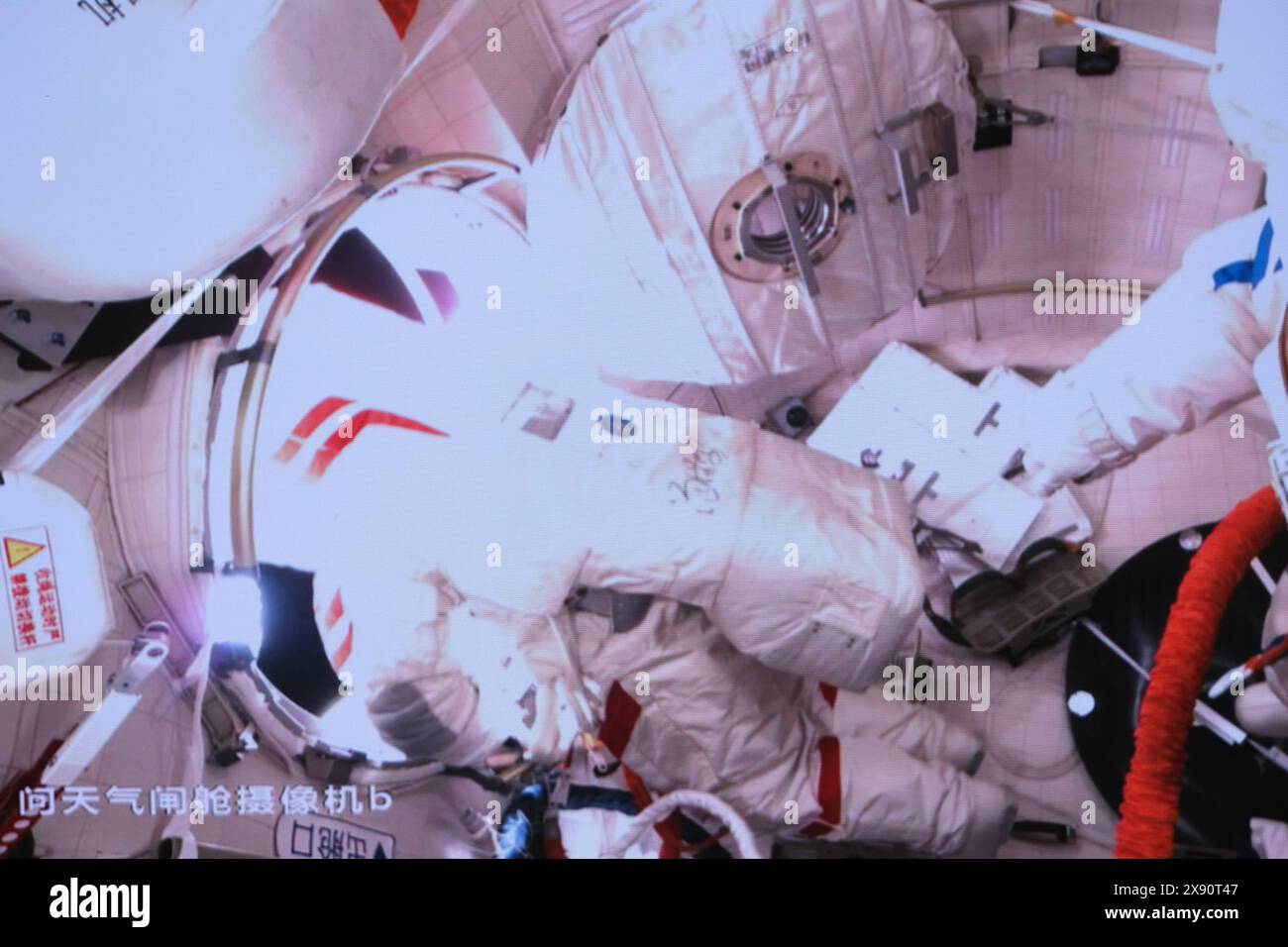 Beijing, China. 28th May, 2024. This screen image captured at Beijing Aerospace Control Center on May 28, 2024 shows Shenzhou-18 astronaut Ye Guangfu going out for extravehicular activities. The Shenzhou-18 crew members on board China's orbiting space station completed their first spacewalk on Tuesday, according to the China Manned Space Agency. Credit: Li Jie/Xinhua/Alamy Live News Stock Photo