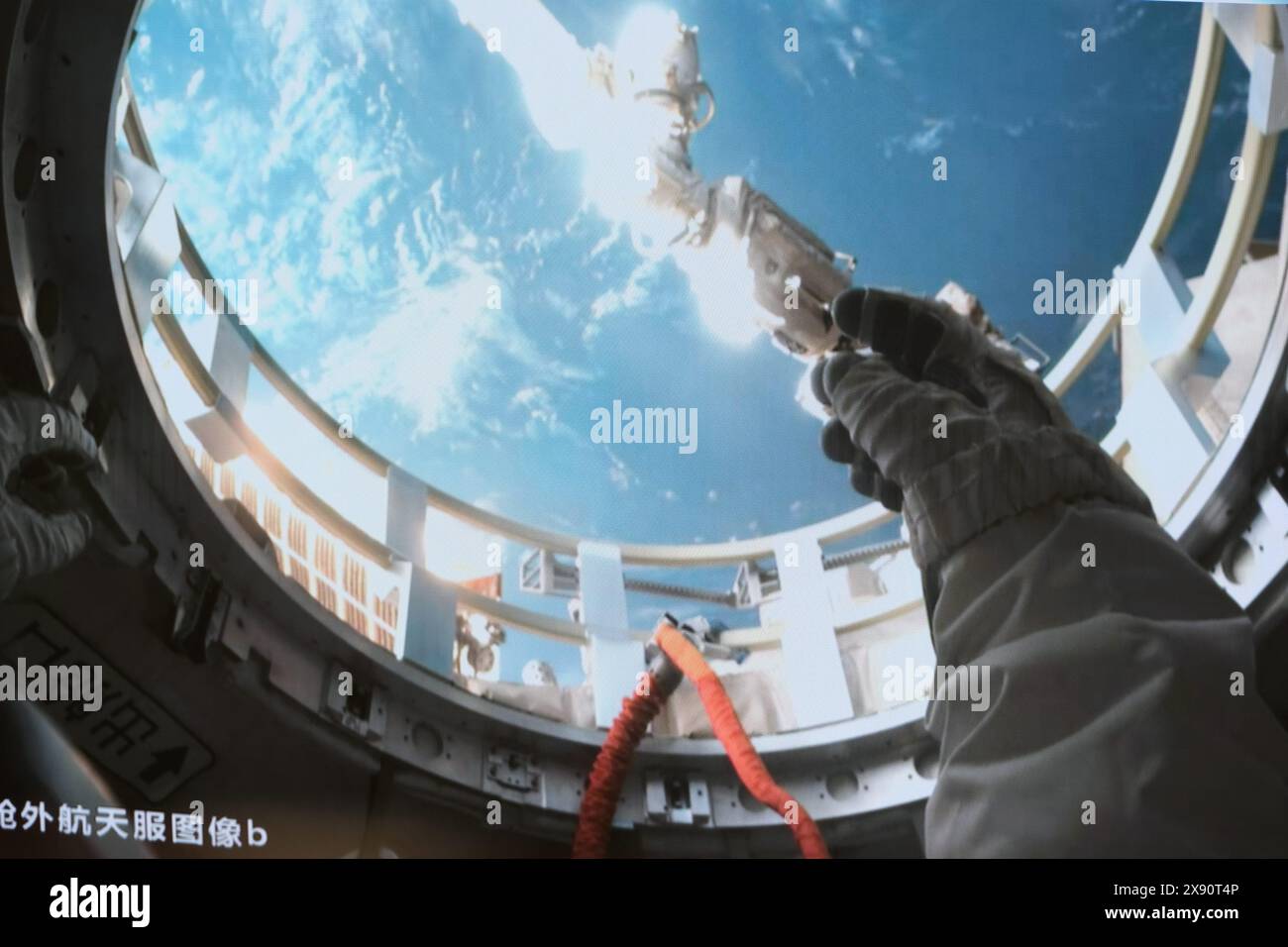 Beijing, China. 28th May, 2024. This screen image captured at Beijing Aerospace Control Center on May 28, 2024 shows Shenzhou-18 astronaut Li Guangsu preparing for extravehicular activities. The Shenzhou-18 crew members on board China's orbiting space station completed their first spacewalk on Tuesday, according to the China Manned Space Agency. Credit: Li Jie/Xinhua/Alamy Live News Stock Photo