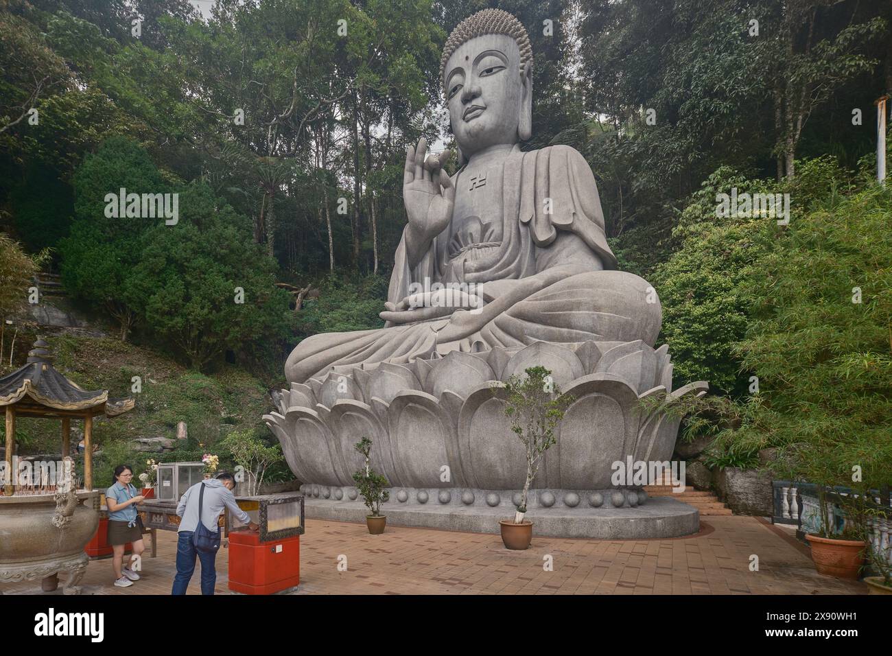 Large statue of Buddha in The Chin Swee Caves Temple in Genting Highlands, Pahang, Malaysia a Chinese temple situated in most scenic site of Genting Stock Photo