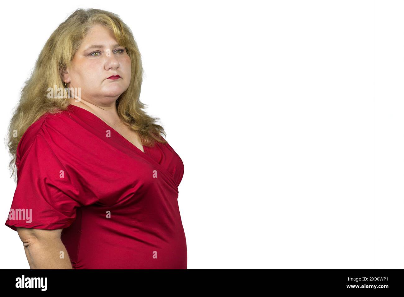 The image beautifully captures a 50-year-old Caucasian woman with blonde hair, radiating a sense of timeless beauty and elegance. Stock Photo