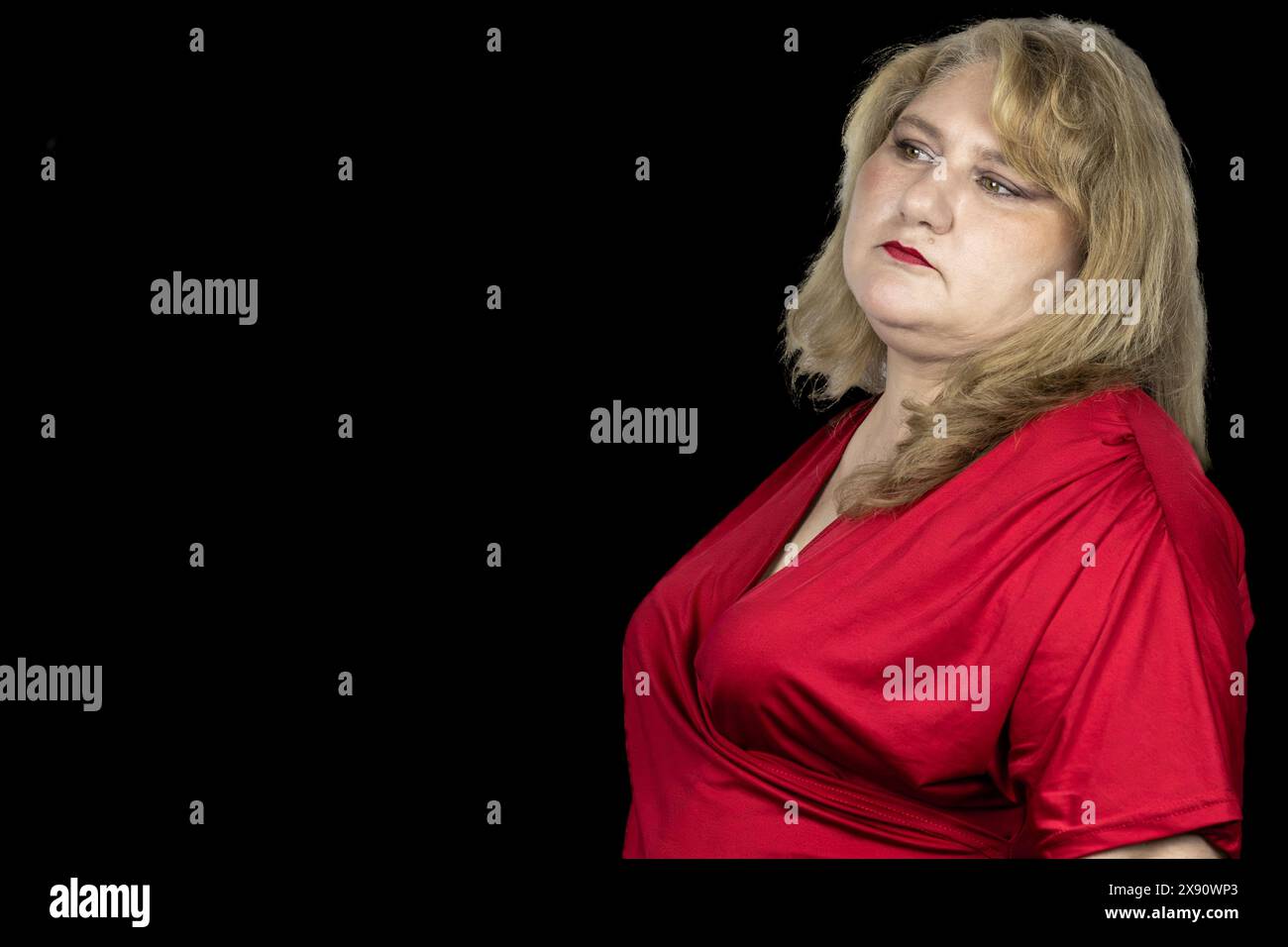 The image beautifully captures a 50-year-old Caucasian woman with blonde hair, radiating a sense of timeless beauty and elegance. Stock Photo