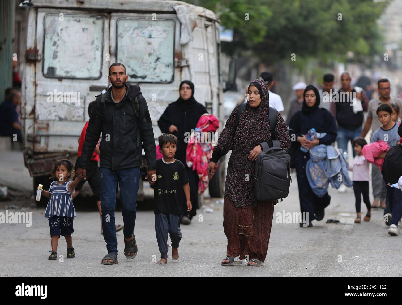 Rafah. 28th May, 2024. Palestinians flee from home in the southern Gaza Strip city of Rafah, on May 28, 2024. The United Nations Relief and Works Agency for Palestine Refugees said on social media platform X that nearly one million people were forced to flee from Rafah during the past three weeks, as a result of the Israeli bombing of the city. Credit: Khaled Omar/Xinhua/Alamy Live News Stock Photo