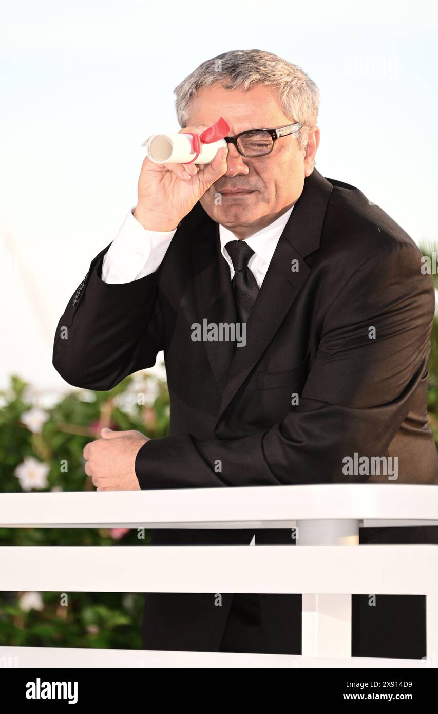 The Prix Spécial (Special Award for Best Screenplay) for the film 'The Seed of the Sacred Fig' awarded to its director Mohammad Rasoulof. Photocall of the 77th Cannes Film Festival Winners  May 25, 2024 credit:Jacky Godard/Photo12 Stock Photo