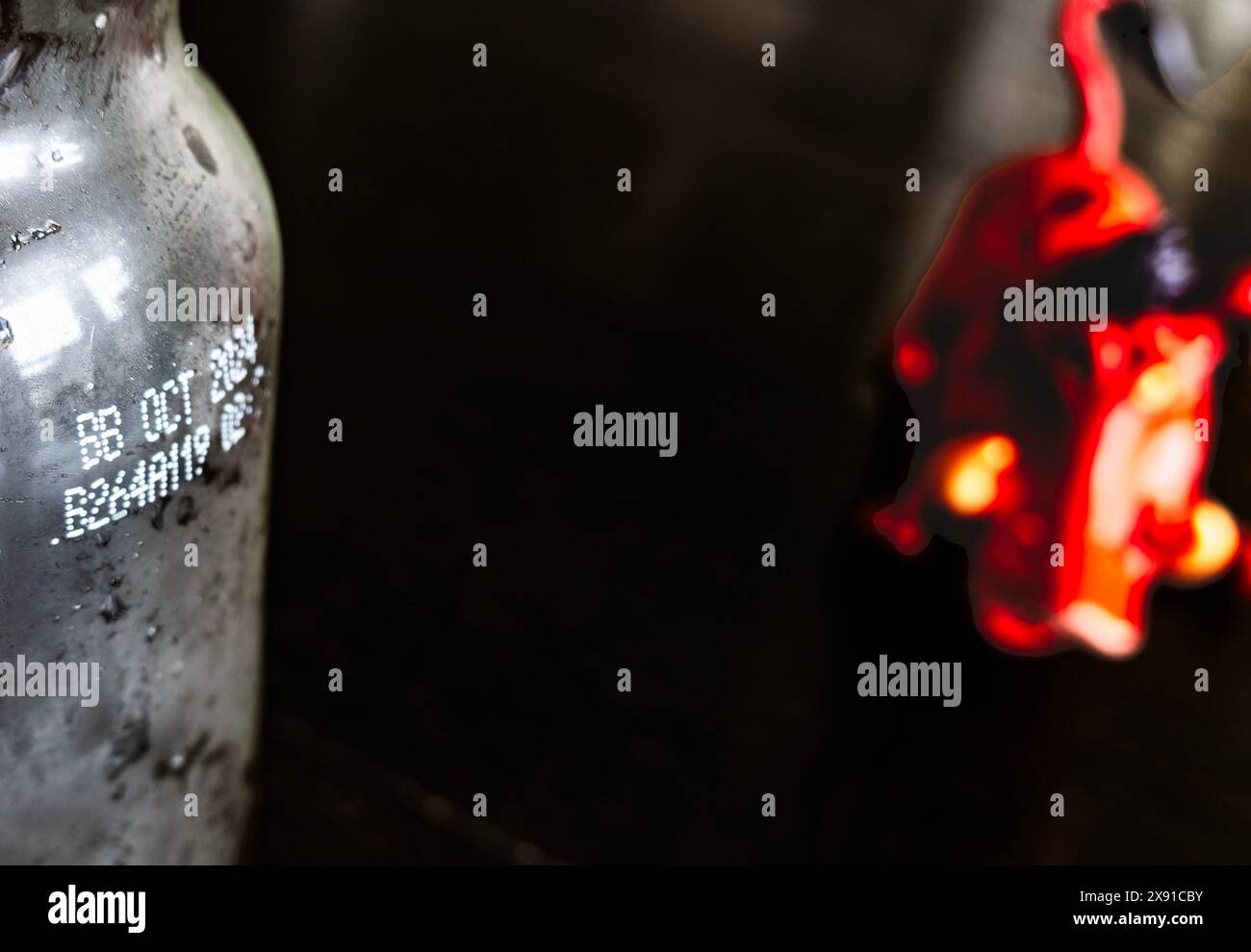 Fantasy, writing stenculed on a glass bottle Stock Photo