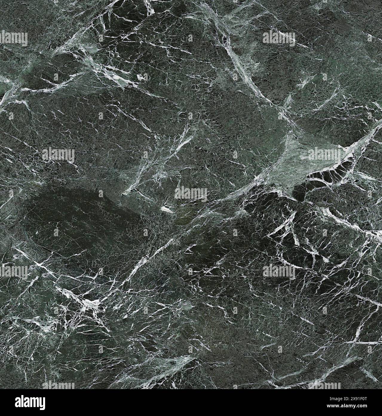Dark green marble with intricate white veins creating a natural ...