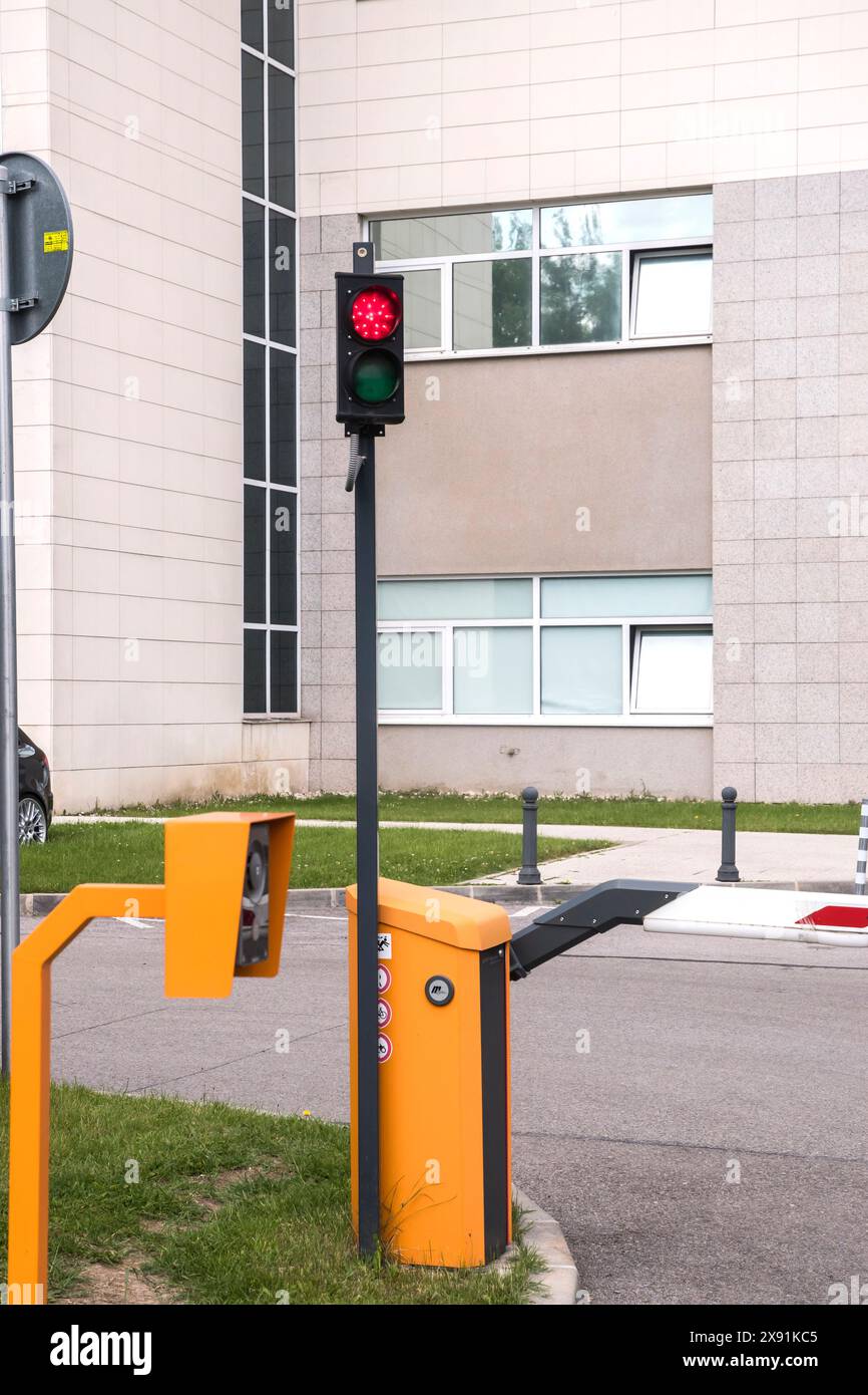 Barrier system with traffic light in the parking lot of public building Stock Photo
