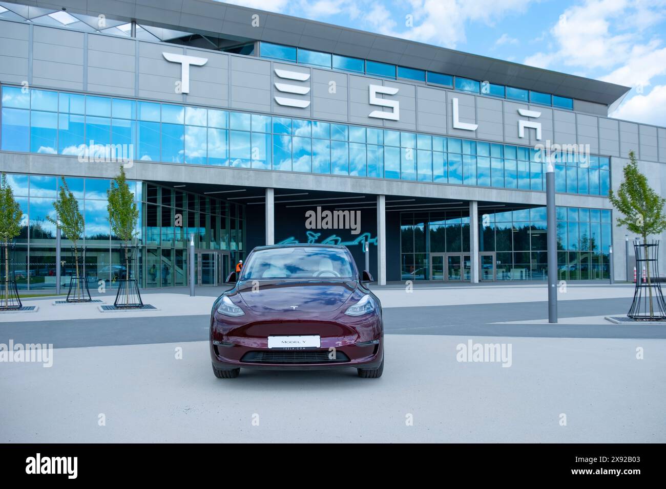 cherry red Tesla model y electric car front Gigafactory Berlin