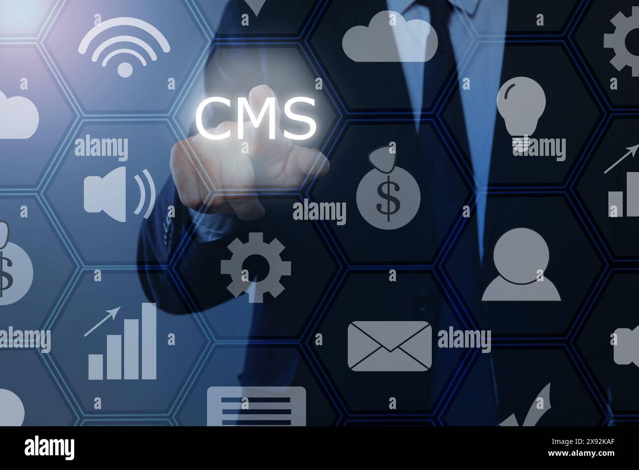 CMS. Man using virtual screen, closeup. Scheme with icons on blue background Stock Photo