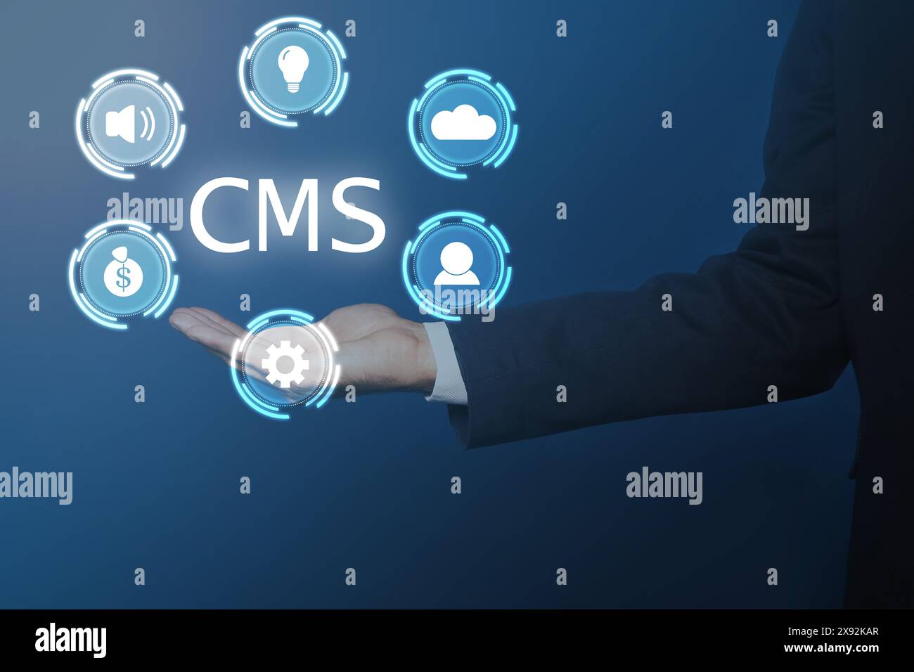 CMS. Man using virtual screen, closeup. Scheme with icons on blue background Stock Photo