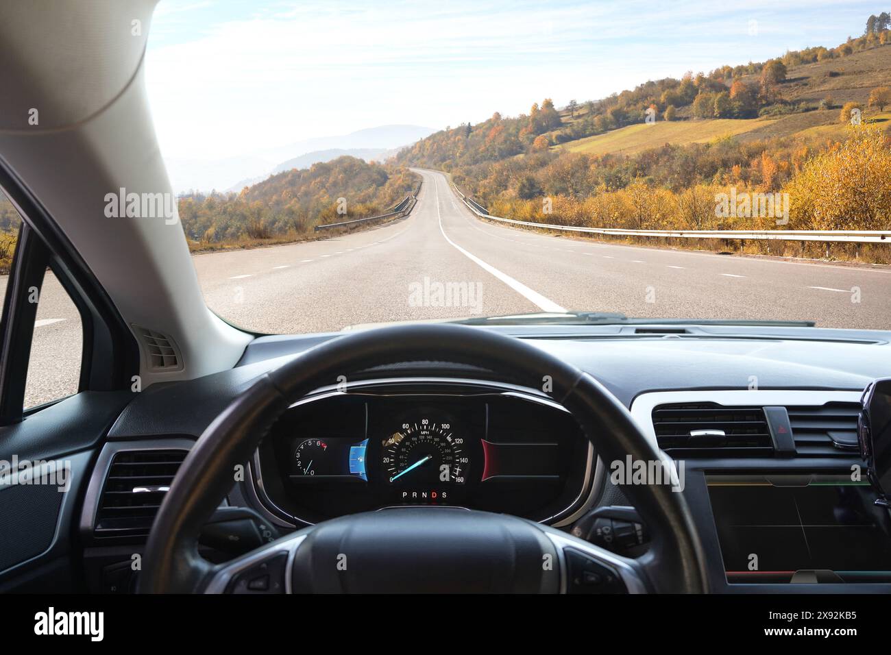 Dashboard with speedometer behind steering wheel inside car Stock Photo ...