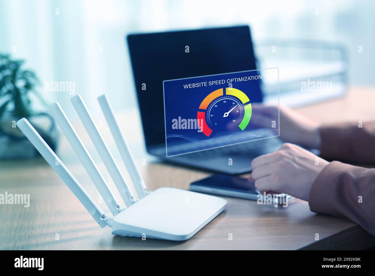 Website speed optimization. Man using laptop at table, closeup. Virtual screen over device Stock Photo