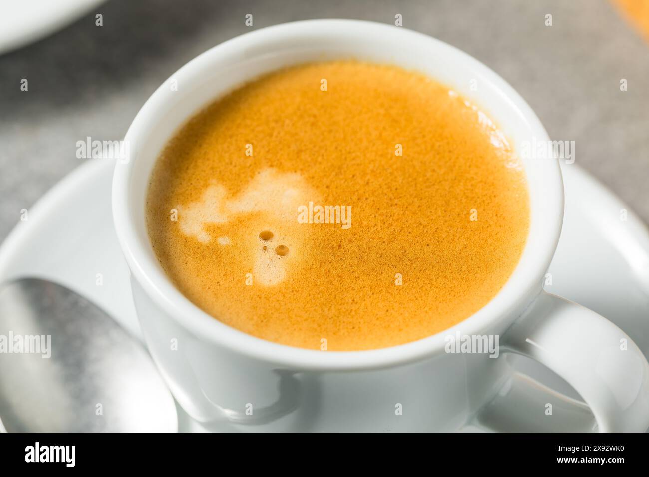 Warm Hot Dark Italian Espresso Coffee Shot in a Cup Stock Photo