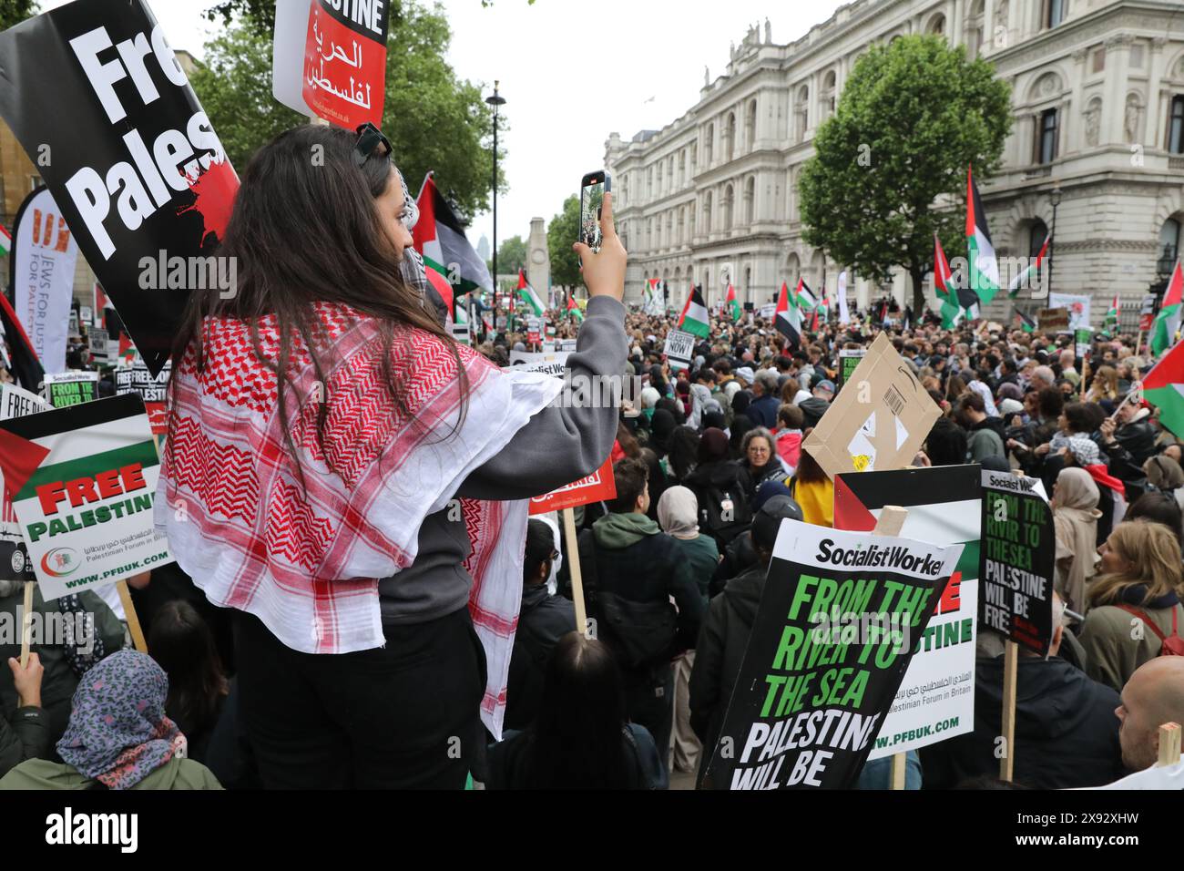 London, UK 28th, May 2024. Tens of thousands gathered outside Downing Street this evening to protest against Israel's assault on Rafah which resulted in Palestinian civilians being burnt alive in their tents, described by Israeli PM Netanyahu as 'a tragic mishap', to call for an immediate ceasefire & to condemn Rishi Sunak and Keir Starmer and their parties with the upcoming election. The protest resulted in Whitehall being closed to traffic & ended with a sit in outside Downing Street. Credit : Monica Wells/Alamy Live News Stock Photo