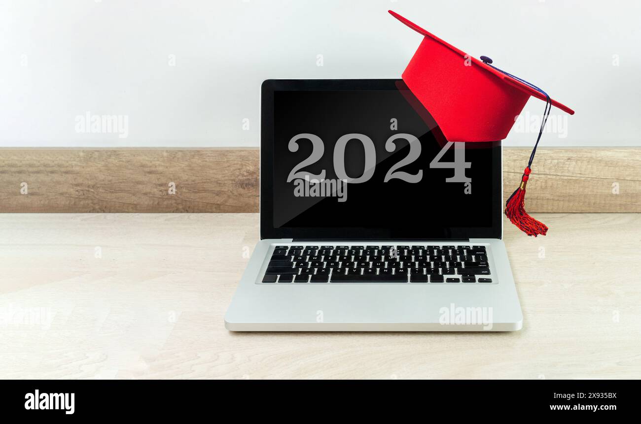 Led Screen Graduates Laptop with red graduates cap with the number 2024 on the screen ...