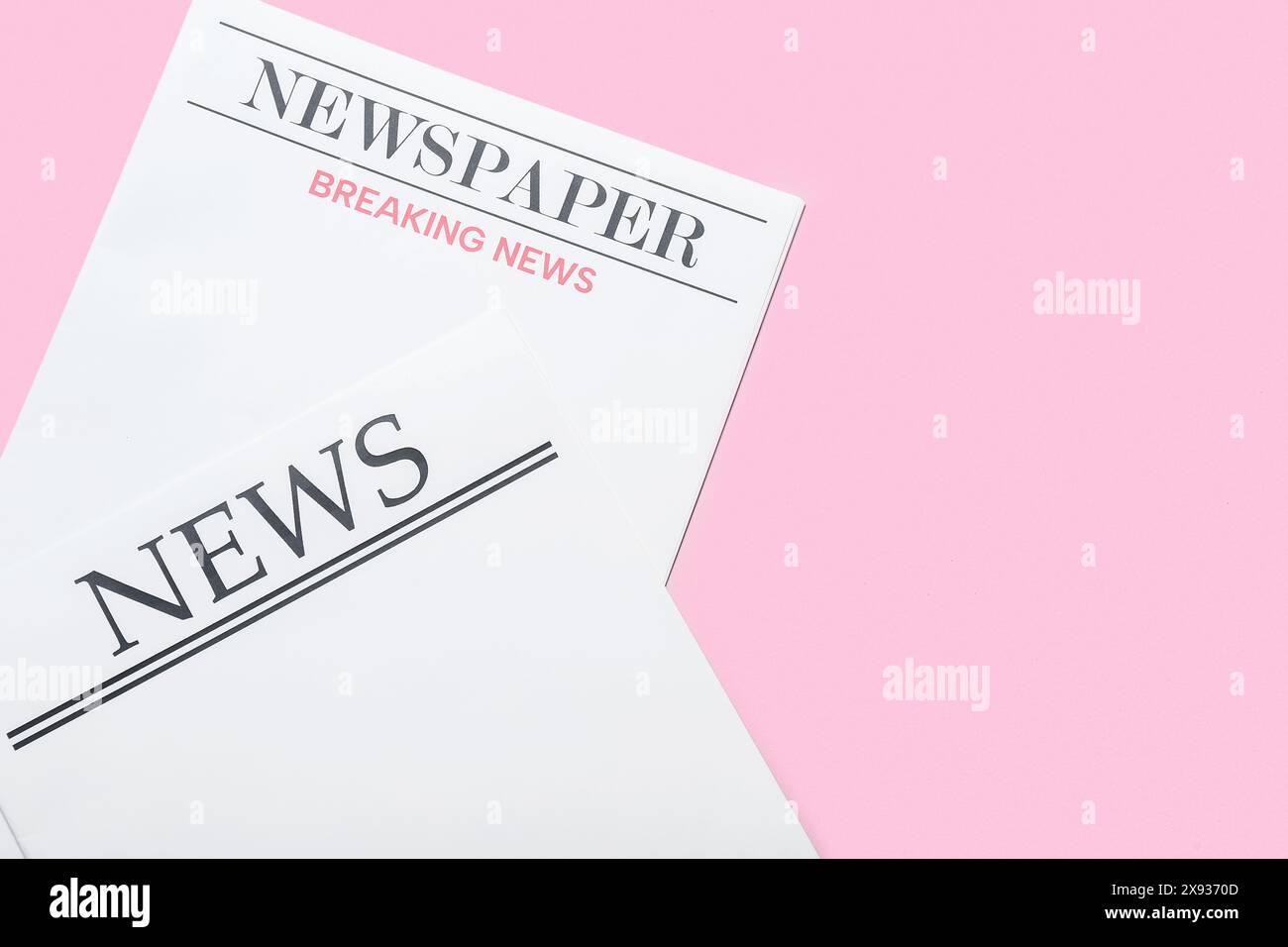 Blank newspapers on pink background Stock Photo