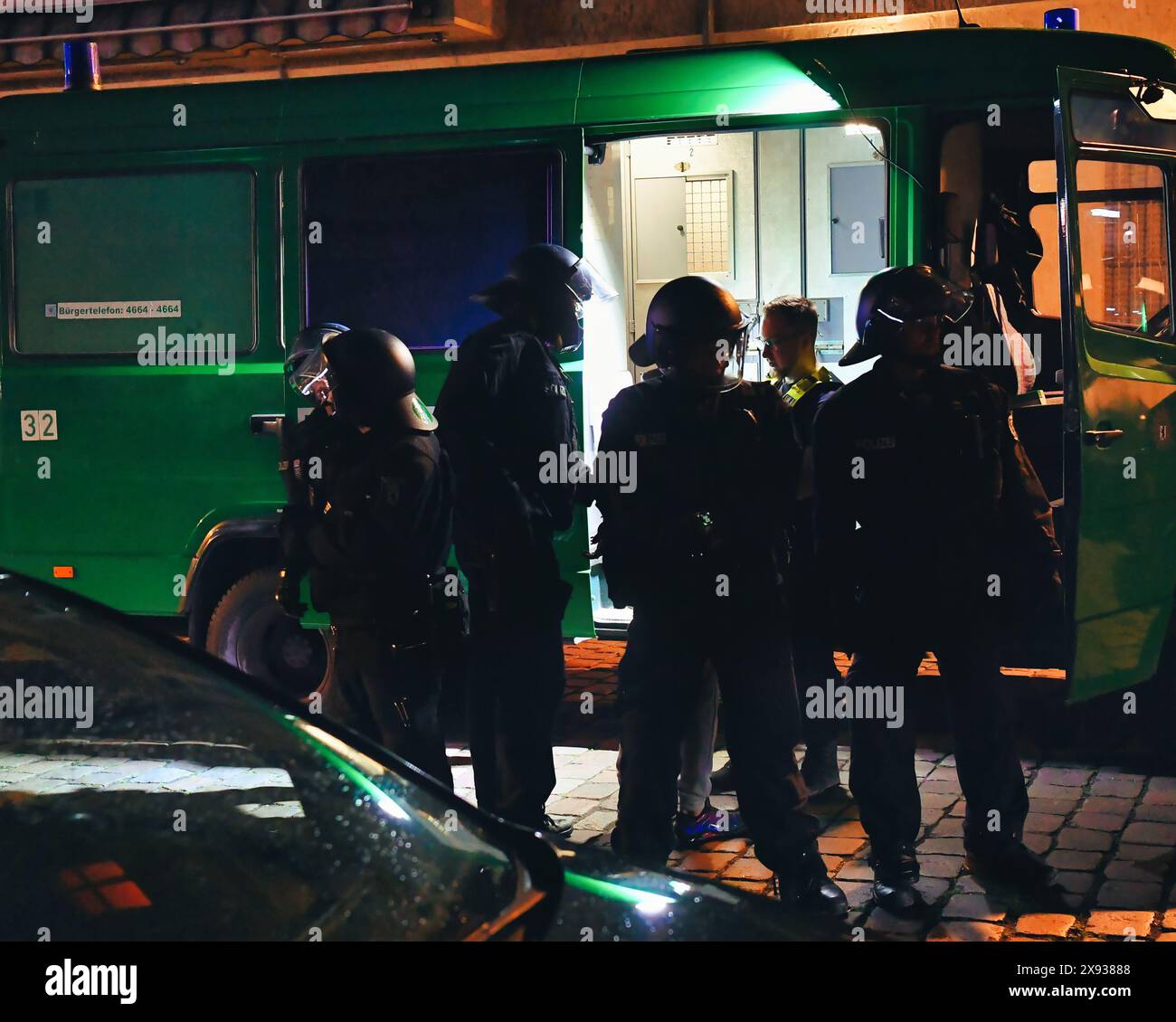 Berlin, Germany. 28th May, 2024. Police officers stand by an emergency vehicle not far from Sonnenallee in Neukölln. In Sonnenallee, there were sometimes violent clashes between people chanting 'Freedom for Palestine'. Credit: Paul Zinken/dpa/Alamy Live News Stock Photo