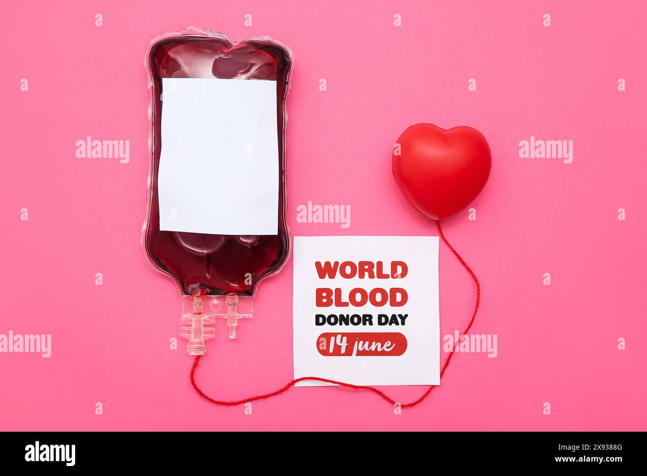 Blood pack for transfusion, heart and paper sheet with text WORLD BLOOD ...