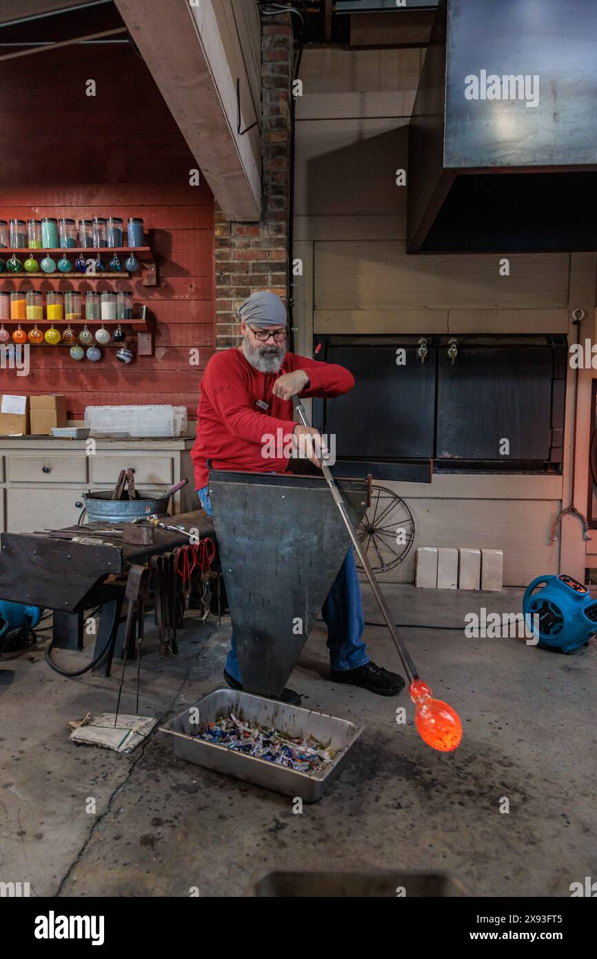 Glass blower demonstrates the art of blowing glass at the Dollywood