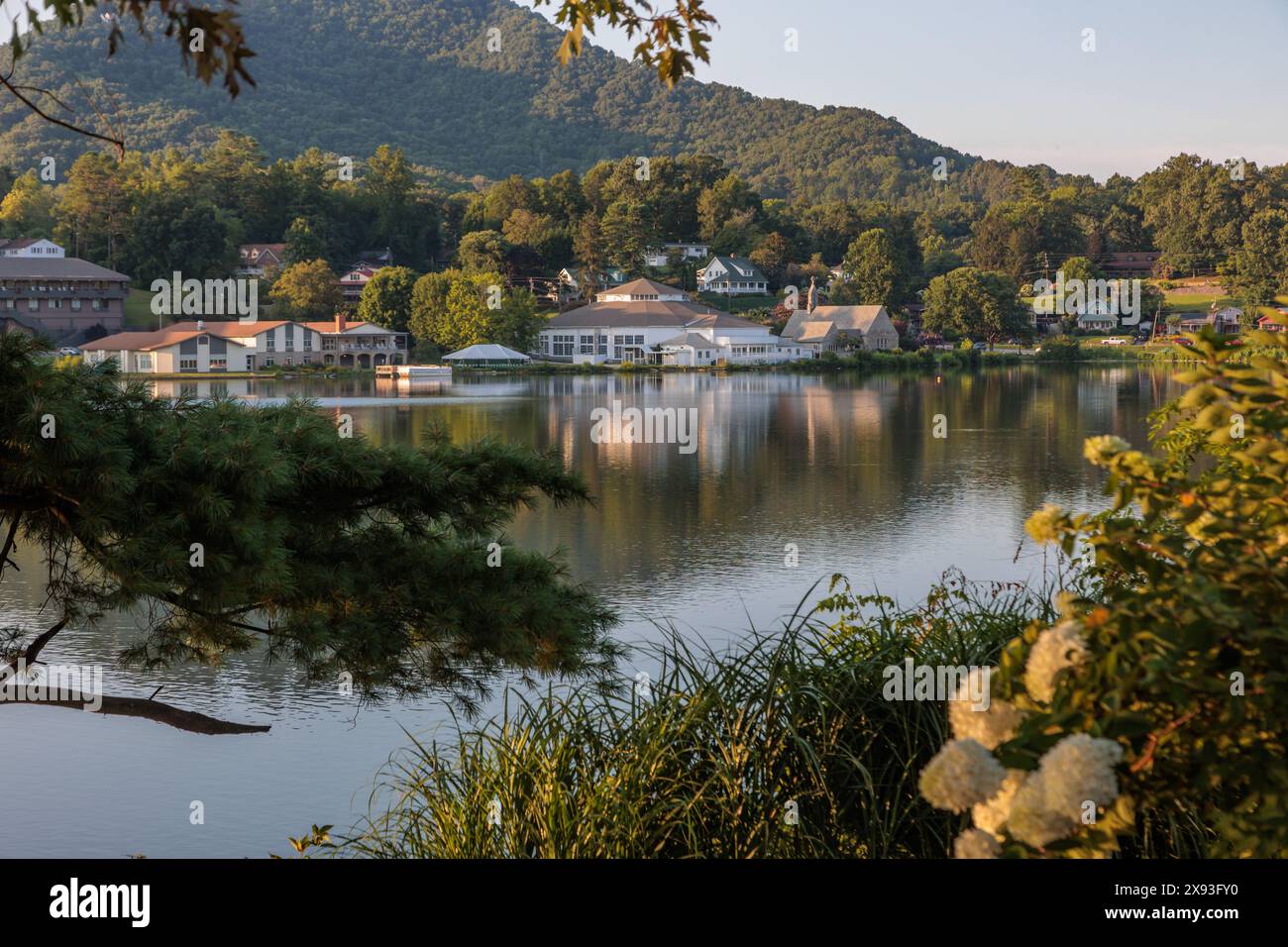 Private homes, Stuart Auditorium, and the Memorial Chapel across the lake at Lake Junaluska, North Carolina Stock Photo