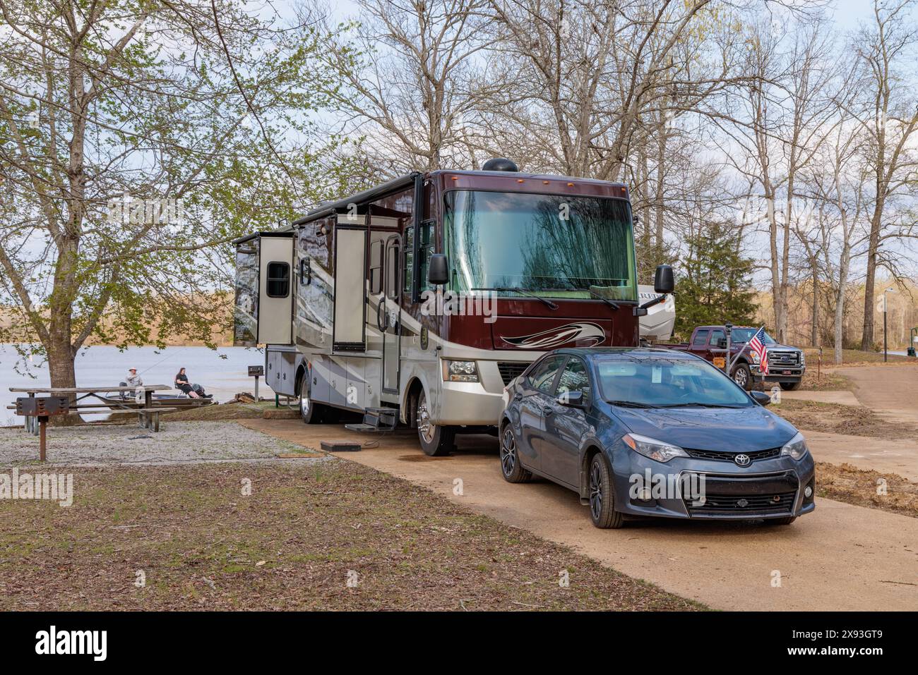 Couple fishing on Aberdeen Lake behind motorhome at Blue Bluff