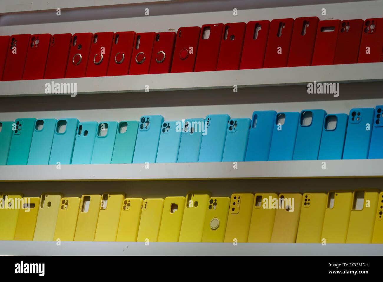 Close up of mobile phone silicone cases displayed on shelves Stock Photo