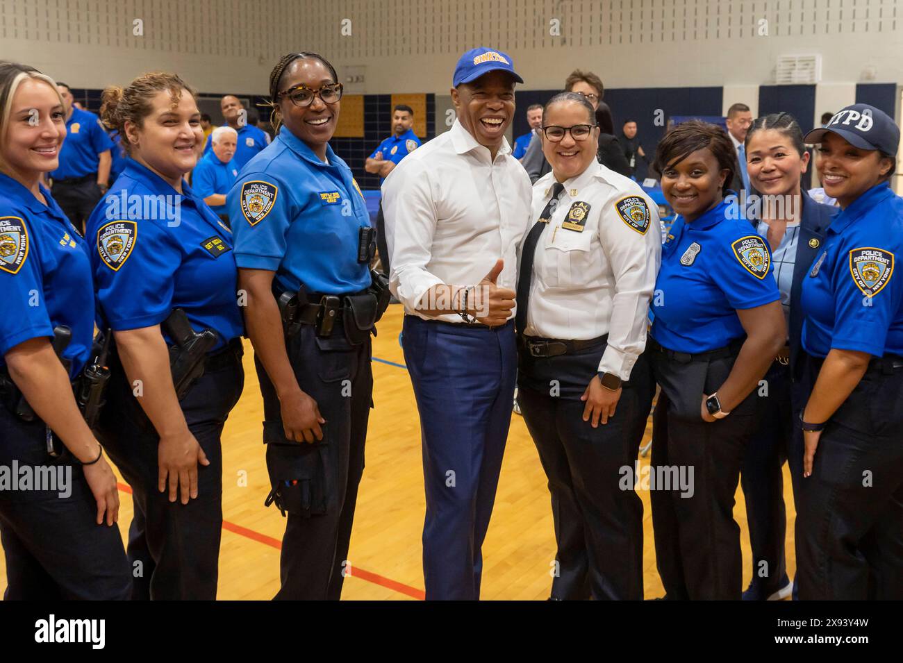 New York, United States. 28th May, 2024. New York City Mayor Eric Adams (C) poses with NYPD Police Officers at Frank Sinatra School of the Arts High School, Astoria on May 28, 2024 in the Queens Borough of New York City. Credit: SOPA Images Limited/Alamy Live News Stock Photo