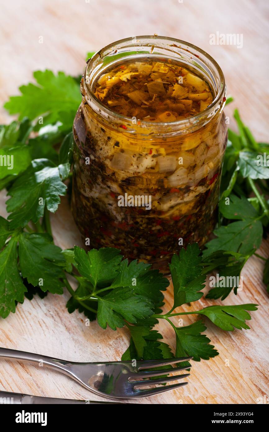 Spicy pickled herring fillets in glass jar Stock Photo Alamy