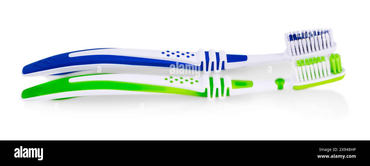 The two toothbrushes isolated on white background Stock Photo - Alamy