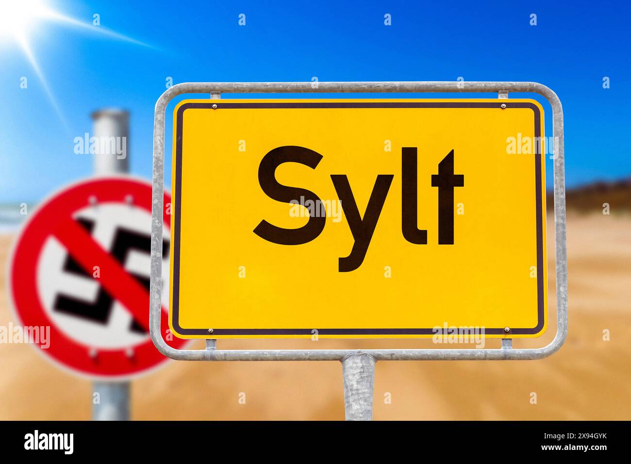 29 May 2025 Sylt town sign on a beach with a crossedout swastika sign