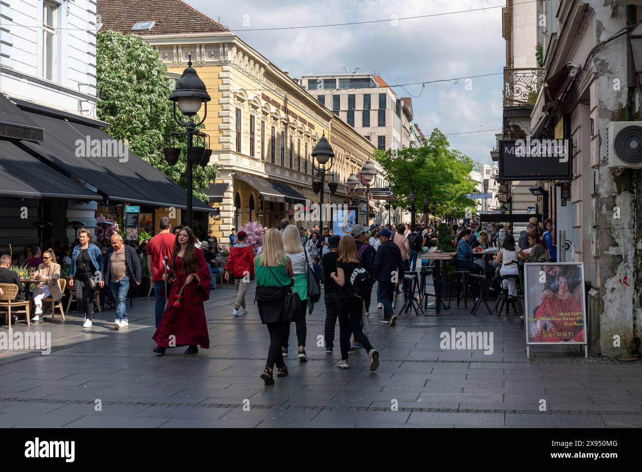 Busy weekend afternoon on Knez Mihailova, main shopping precinct in Belgrade. People shopping and eating in restaurants. May 2024 Stock Photo