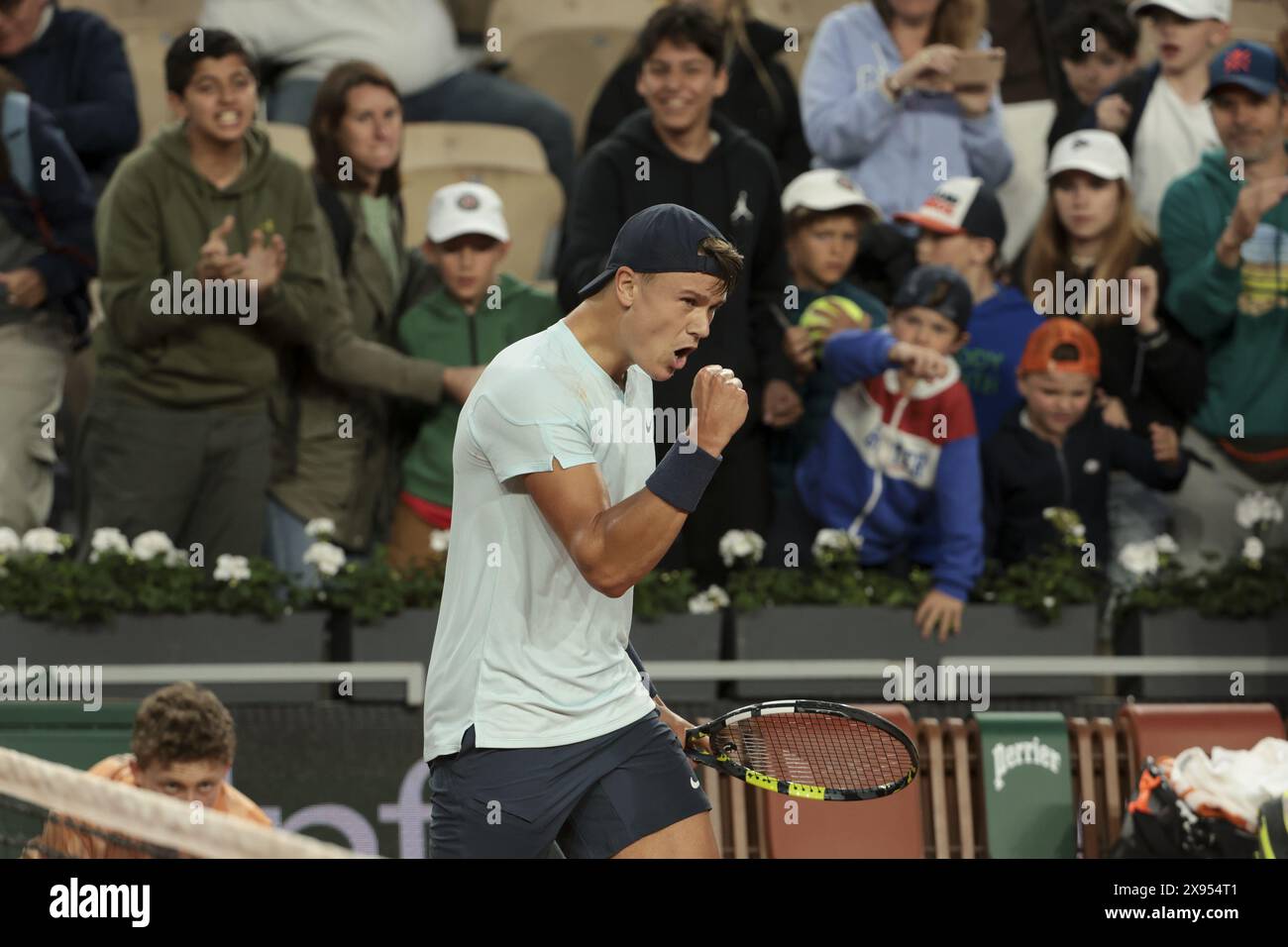 Holger Rune of Denmark celebrates his first round victory during day 3 ...