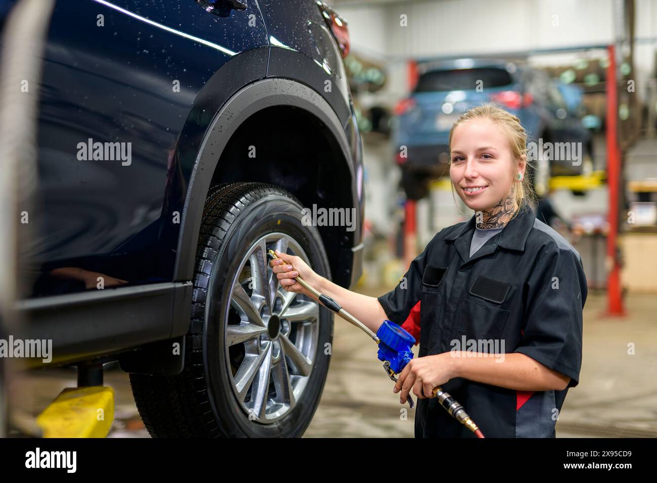 Woman auto tire mechanic in hi-res stock photography and images - Alamy