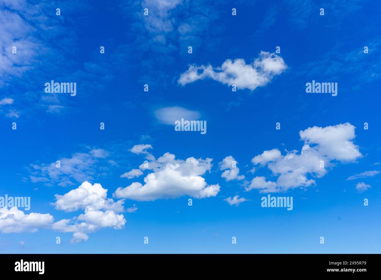 Fleecy clouds with blue sky, Texture background Stock Photo