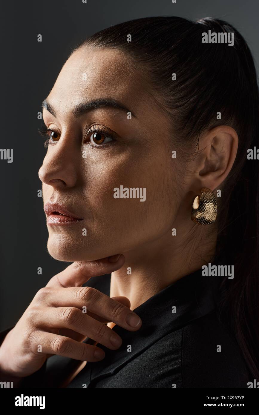 Woman in elegant black suit hi-res stock photography and images - Alamy