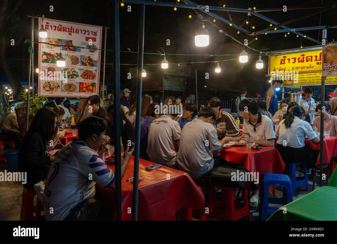 Students from Chiang Mai University eating in street food market, Chiang Mai, Thailand, Southeast Asia, Asia Stock Photo