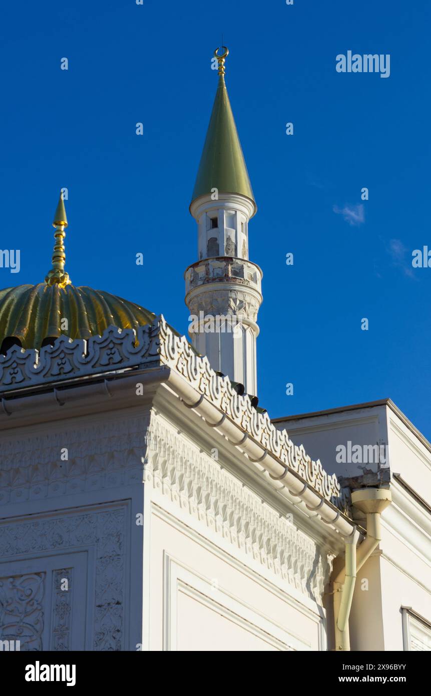 Vertical shot of the minaret and the golden dome with a spire above the Turkish Bath building (Tsarskoye Selo, St. Petersburg, Russia) Stock Photo