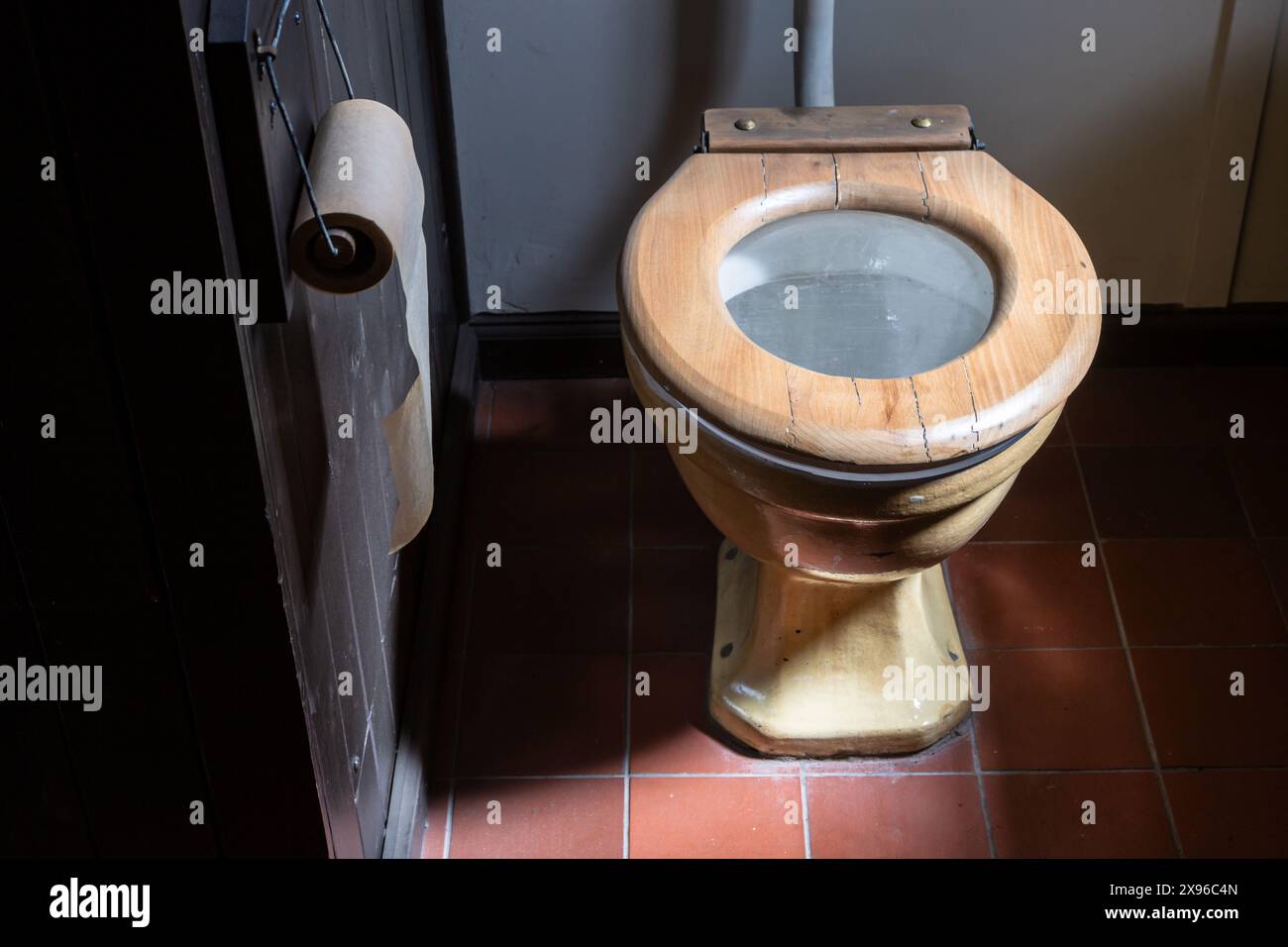 Old mid twentieth century toilet or lavatory and paper roll, UK. Stock Photo
