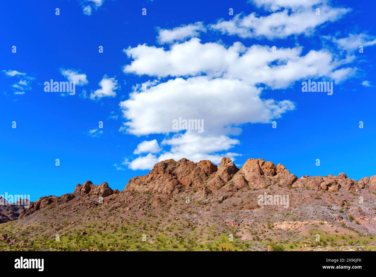 Large Brown Ridge Rugged mountains, composed of reddish-brown rocks and sparsely dotted ...